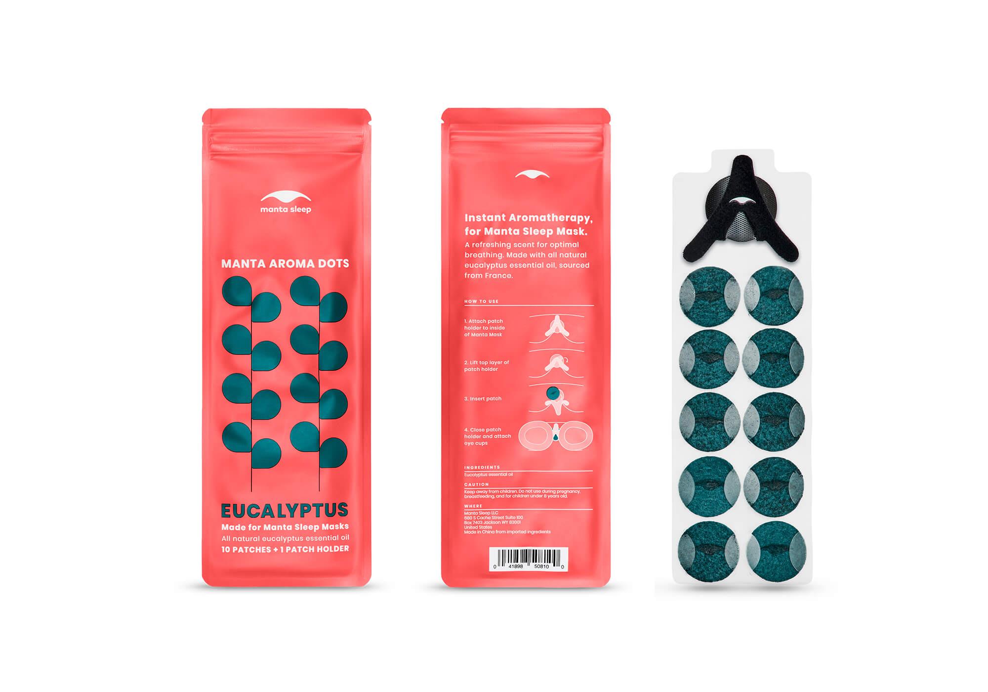 The front and back of a coral Eucalyptus Manta Aroma Dots packet displayed alongside a clear sheet containing 10 dark teal patches and a black holder, on white.