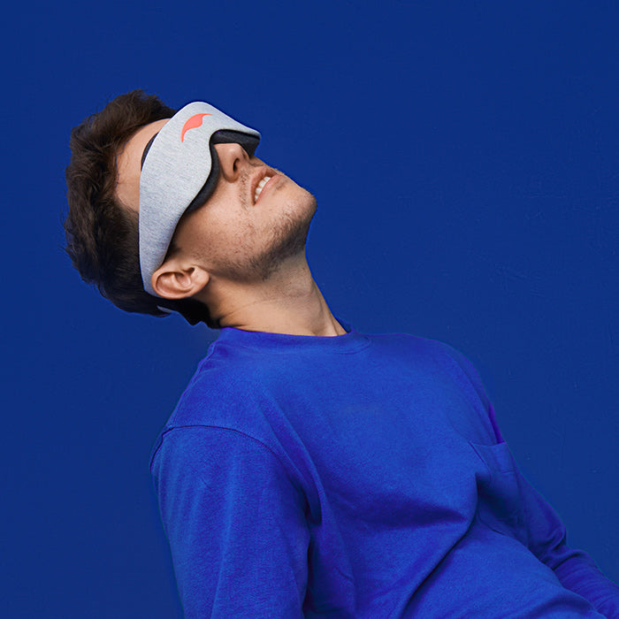 a man wearing a sleeping mask