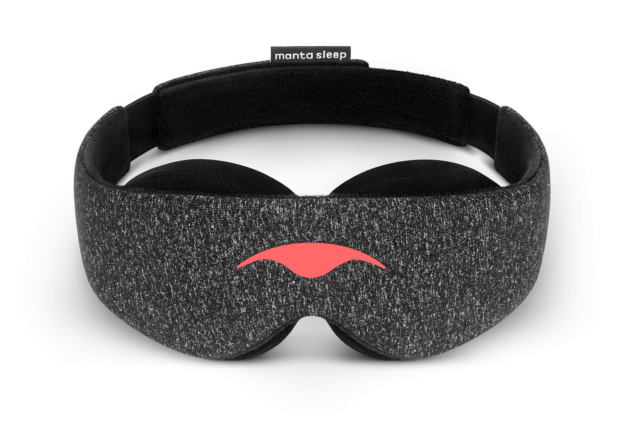 Front view of the Carbon Black Manta Sleep Mask arranged in a freestanding circle on a white surface. The mask features a dark gray speckled heather texture with the coral-red Manta Sleep logo on the front and a black brand label at the rear.