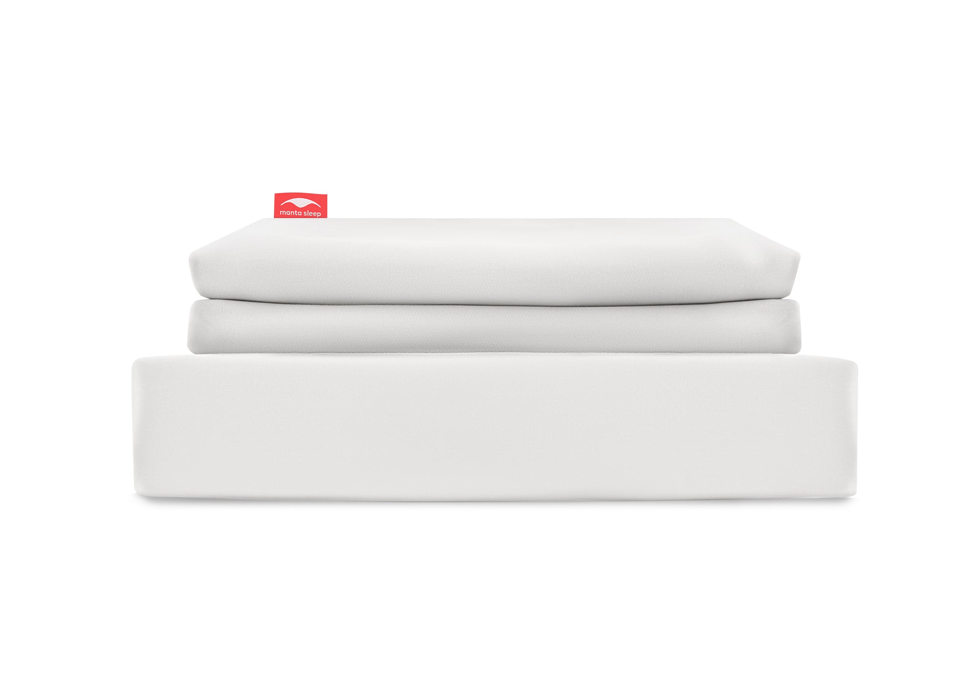 Straight-on studio shot of a white Manta Sleep bedsheet set neatly folded into a clean stack, isolated on a white background.
