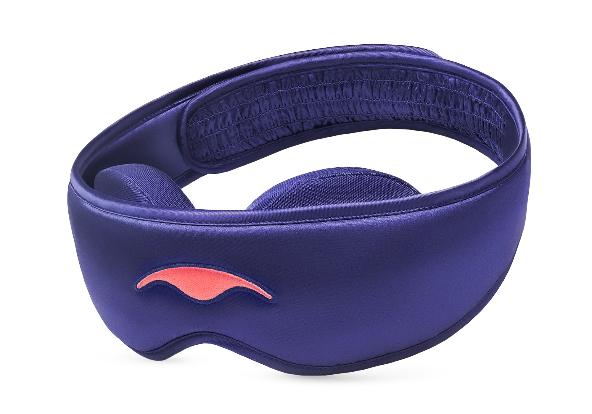 Three-quarter studio shot of the Manta Sleep Mask SILK in lustrous purple, featuring an embroidered coral logo and a ruched back strap section.
