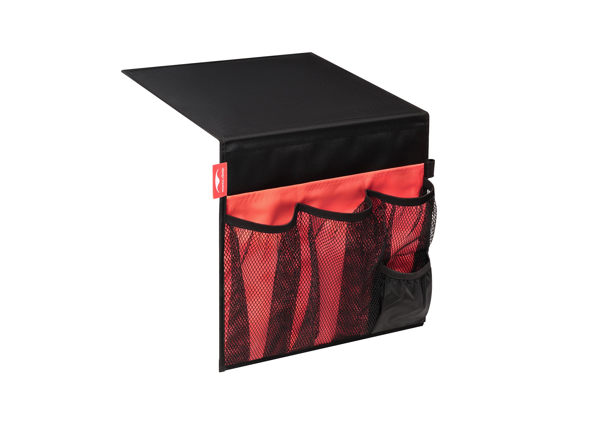 Studio shot of a black and coral Manta Bedside Caddy with empty mesh pockets, angled to show its structure against a white background.