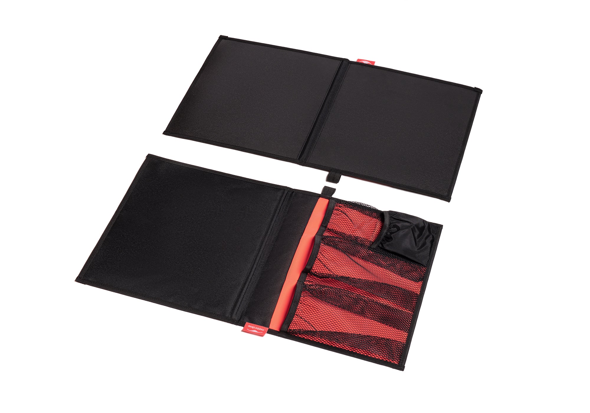 Overhead view of two black and coral Manta Bedside Caddies laid out flat, isolated on a clean white background.