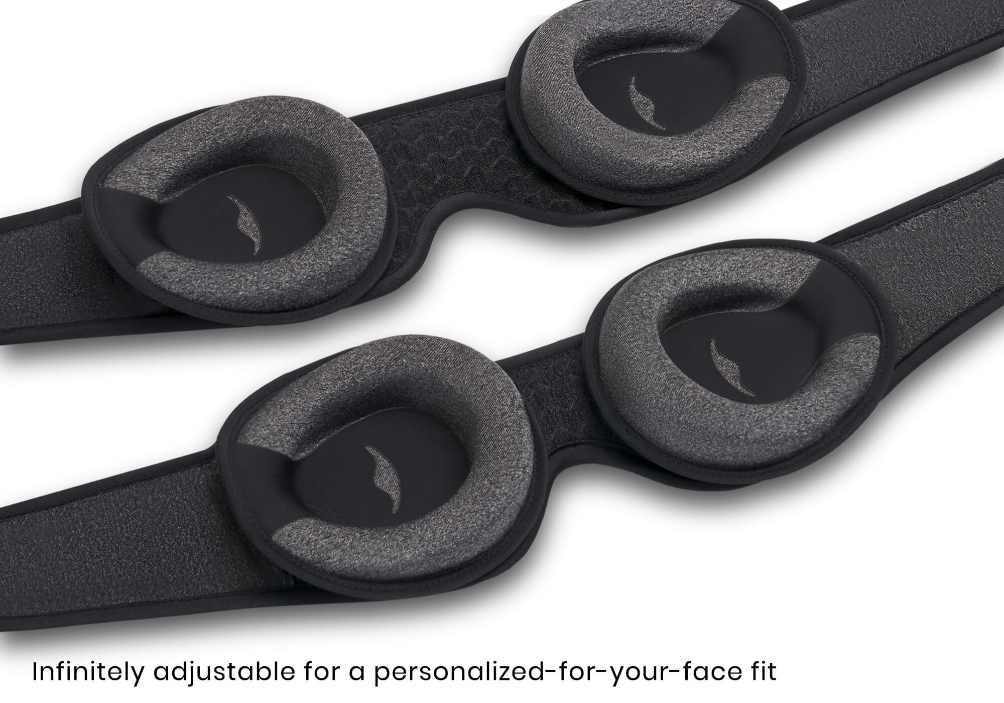 Two Carbon Black sleep masks laid out to show adjustable interior eye cups, with caption "Infinitely adjustable for a personalized-for-your-face fit".
