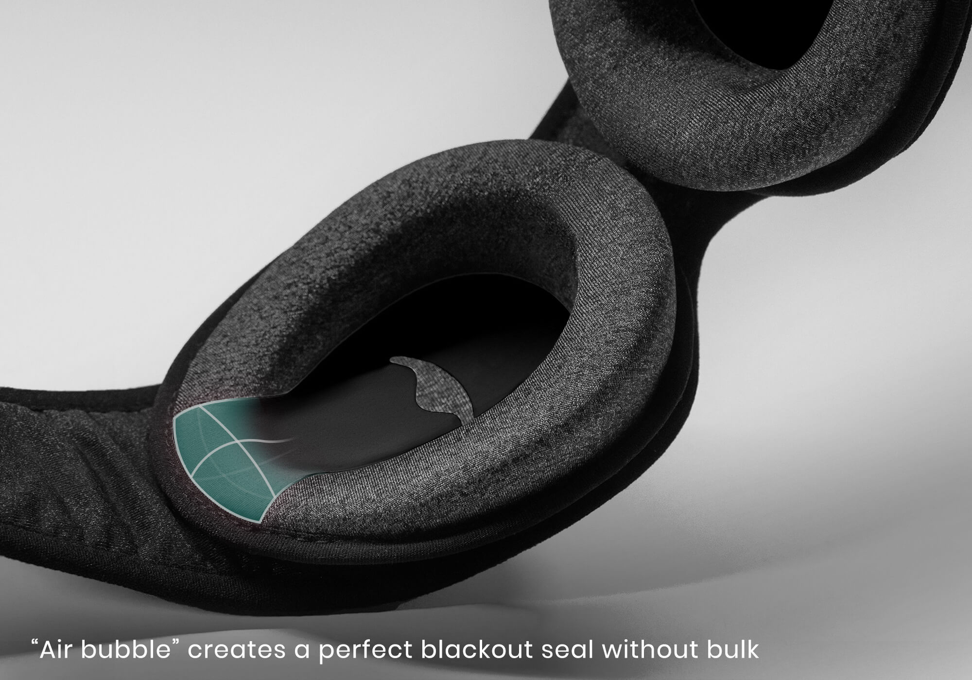 Close-up of a black foam eye cup with a blue highlighted seal overlay, with caption "Air bubble creates a perfect blackout seal without bulk".