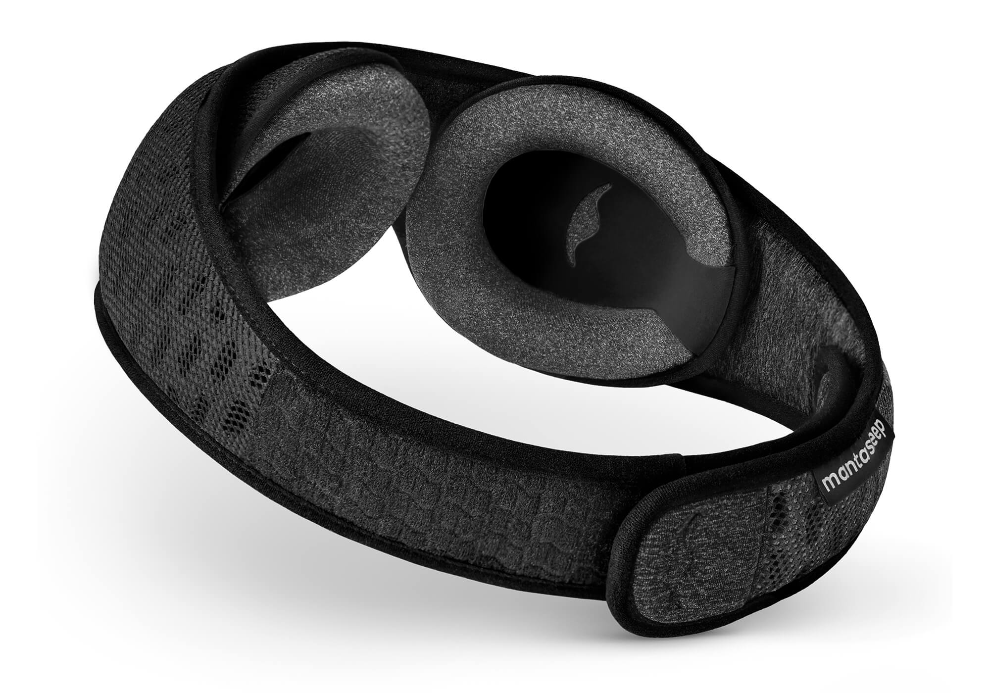 Angled inner view of the Carbon Black Manta Sleep Mask PRO, showing the wide black head strap and adjustable grey foam eye cups.