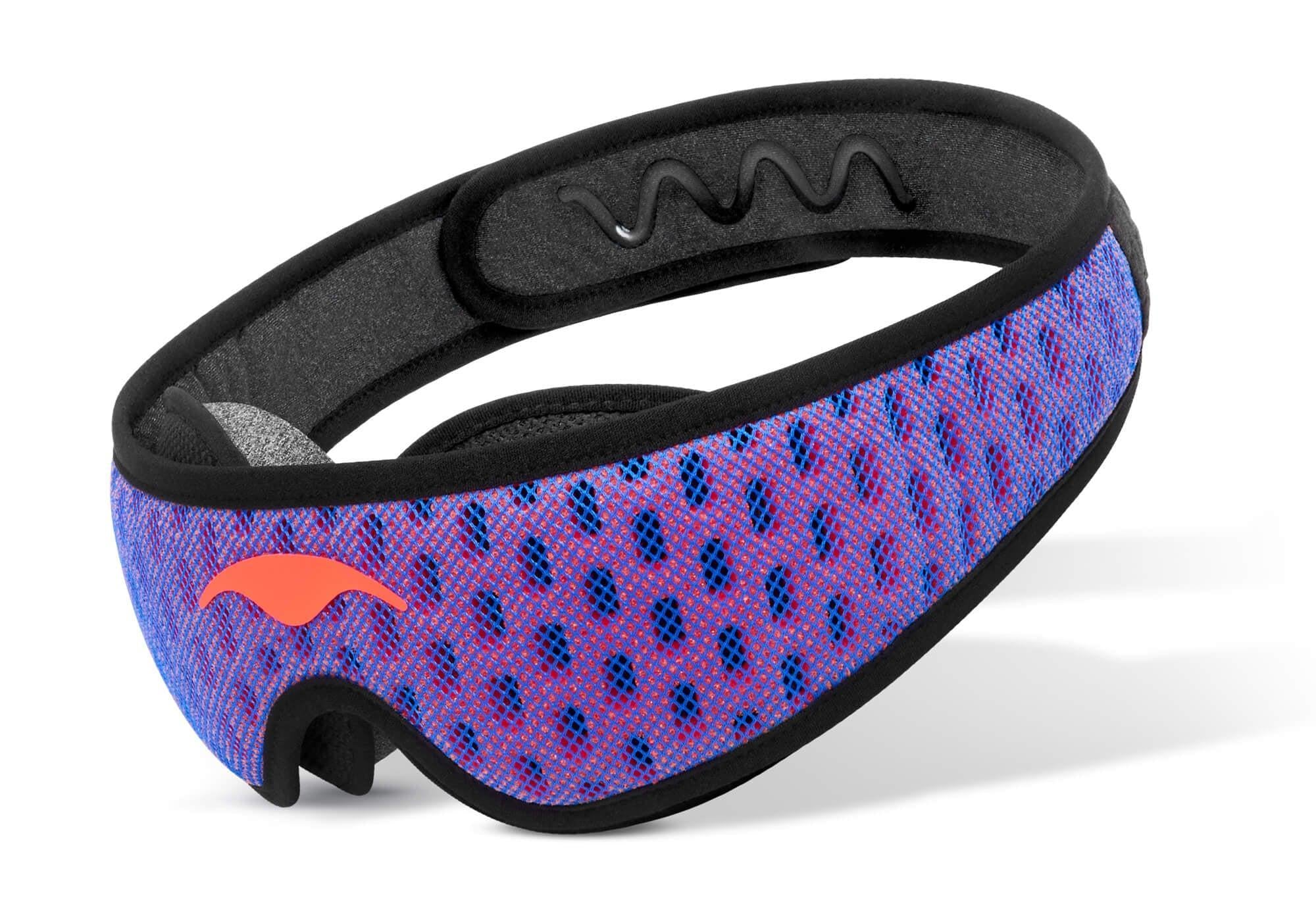 Three-quarter studio shot of the Manta Sleep Mask PRO with a blue and red mesh strap, black borders, and an coral-red Manta Sleep logo.