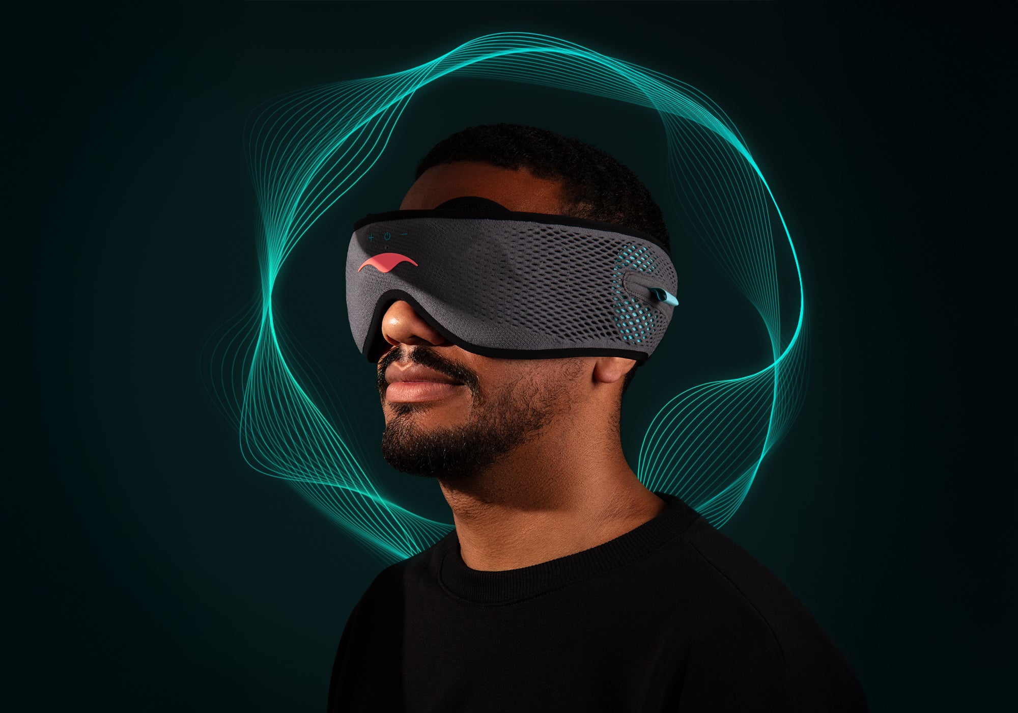 Profile view of a man wearing a grey Manta SOUND Sleep Mask with glowing turquoise soundwaves rippling around his head.
