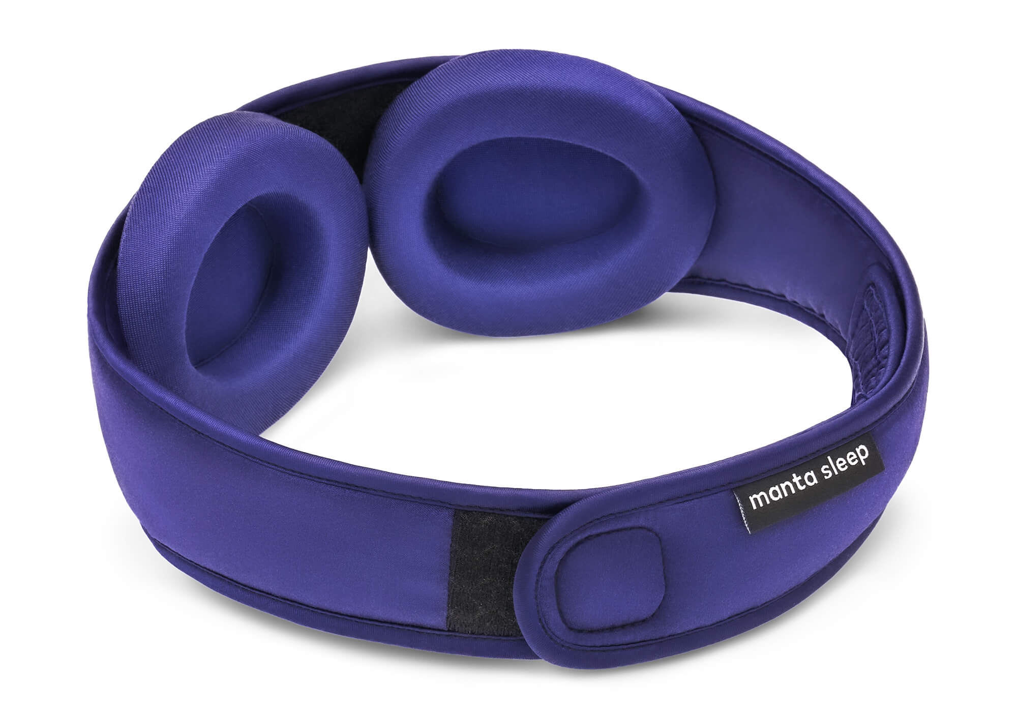 Interior view of the Manta Sleep Mask SILK in purple, displaying the adjustable silk eye cups and a small black brand label on the strap.