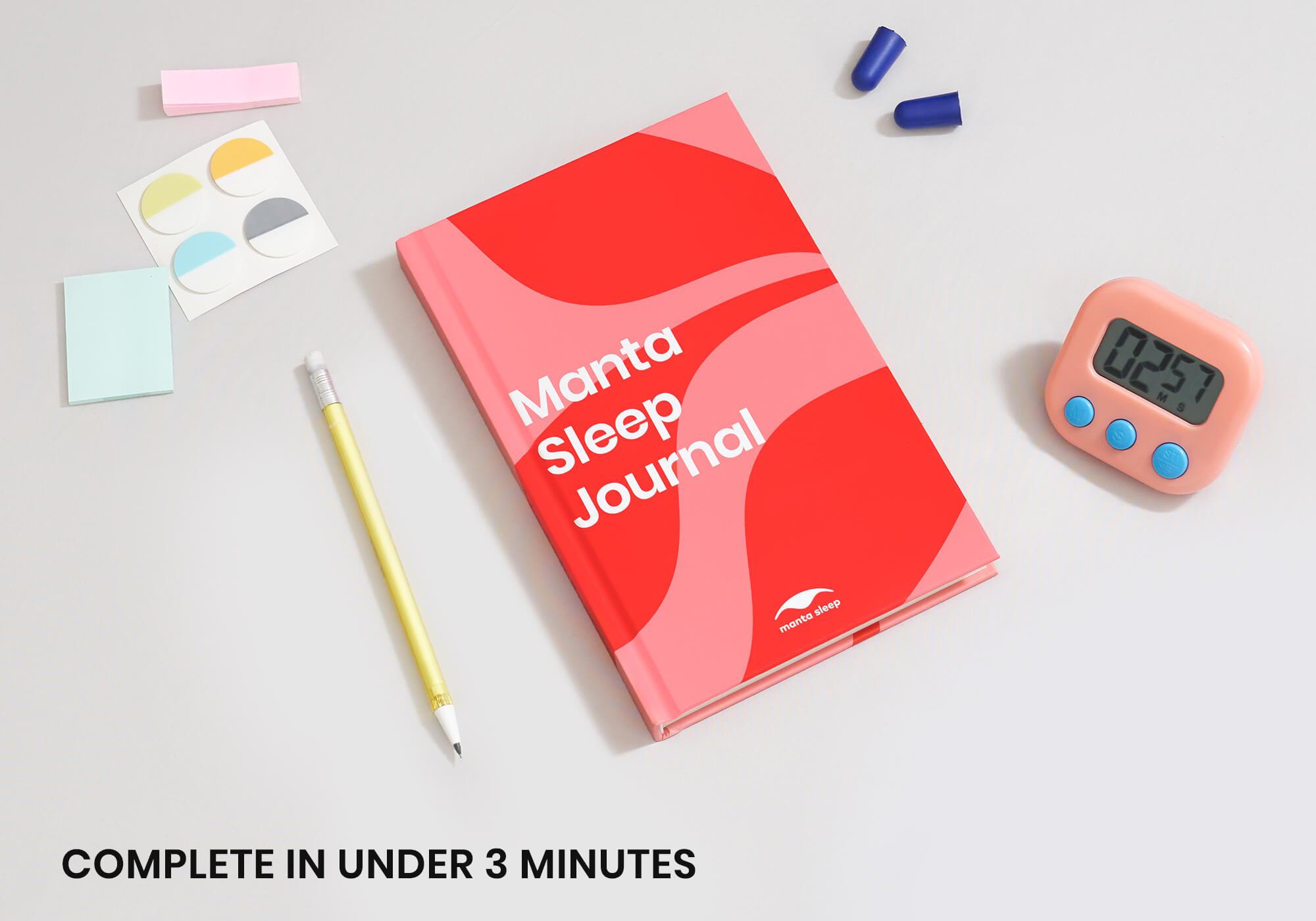 Flat lay of the red Manta Sleep Journal with a pencil, earplugs, stickers, and a digital timer on a plain grey surface.