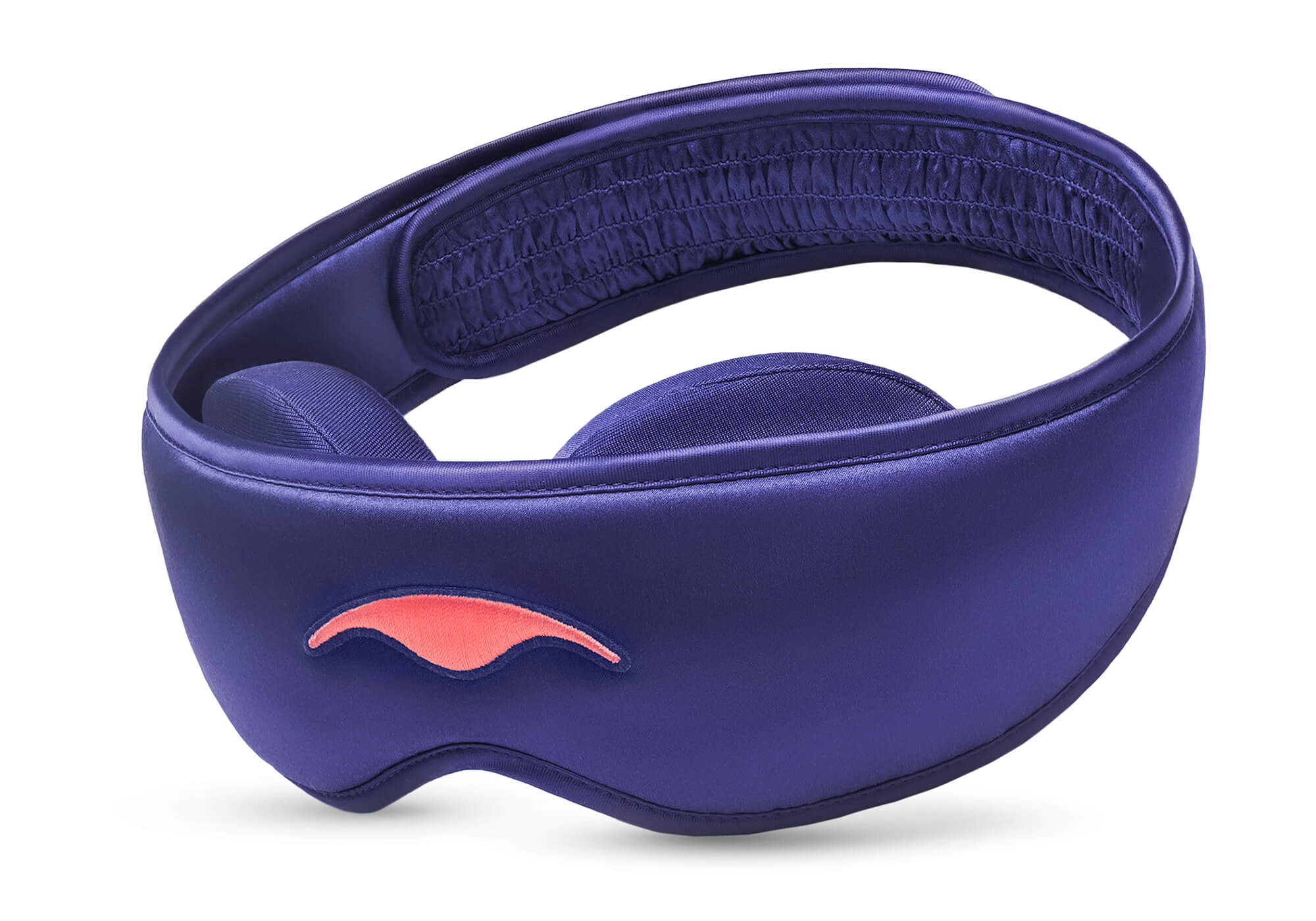Three-quarter studio shot of the Manta SILK Sleep Mask in lustrous purple, featuring an embroidered coral logo and a ruched back strap section.