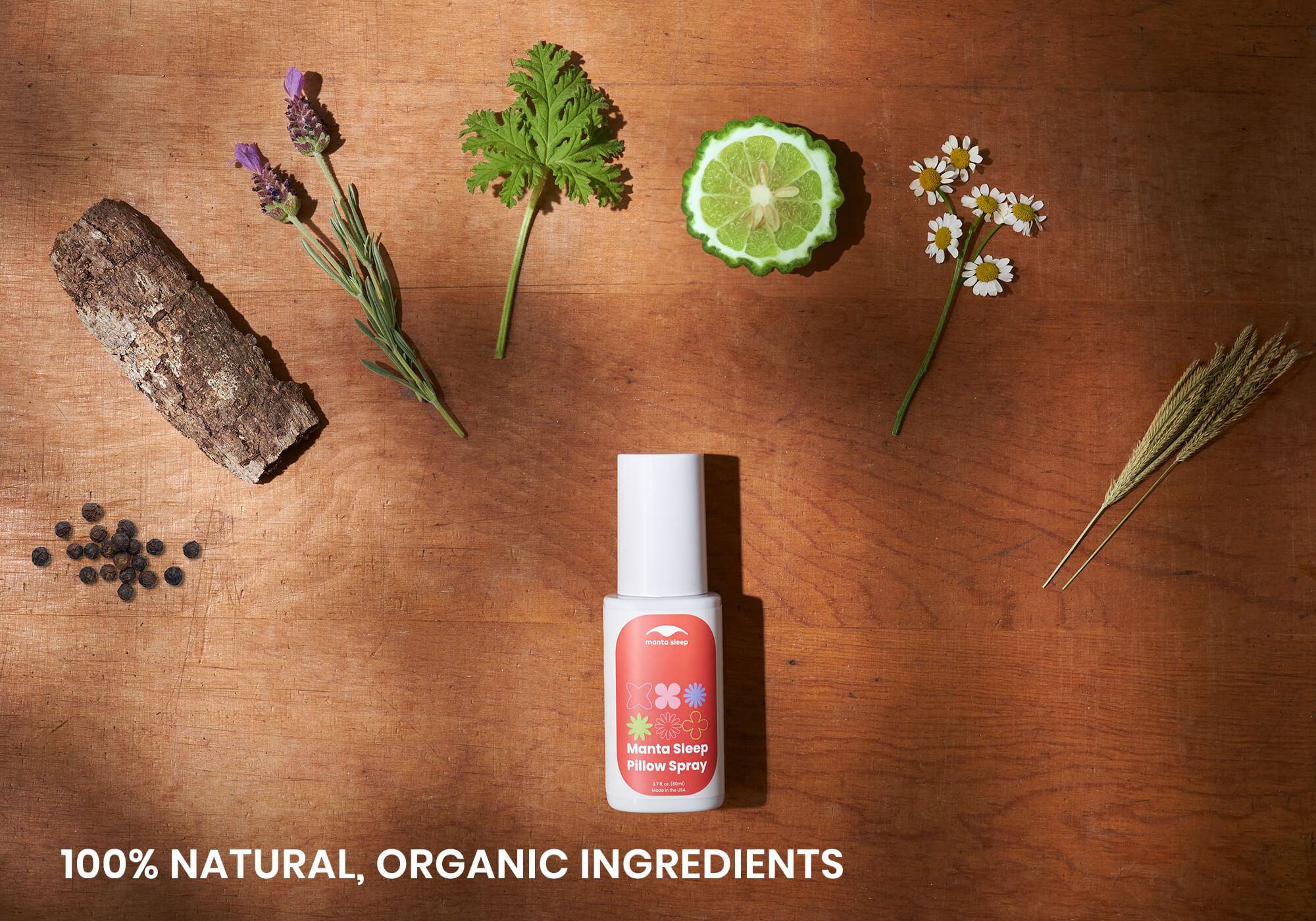 Top-down view of Manta Sleep Pillow Spray surrounded by organic ingredients like lavender, citrus, and bark. Text: 100% natural, organic ingredients.