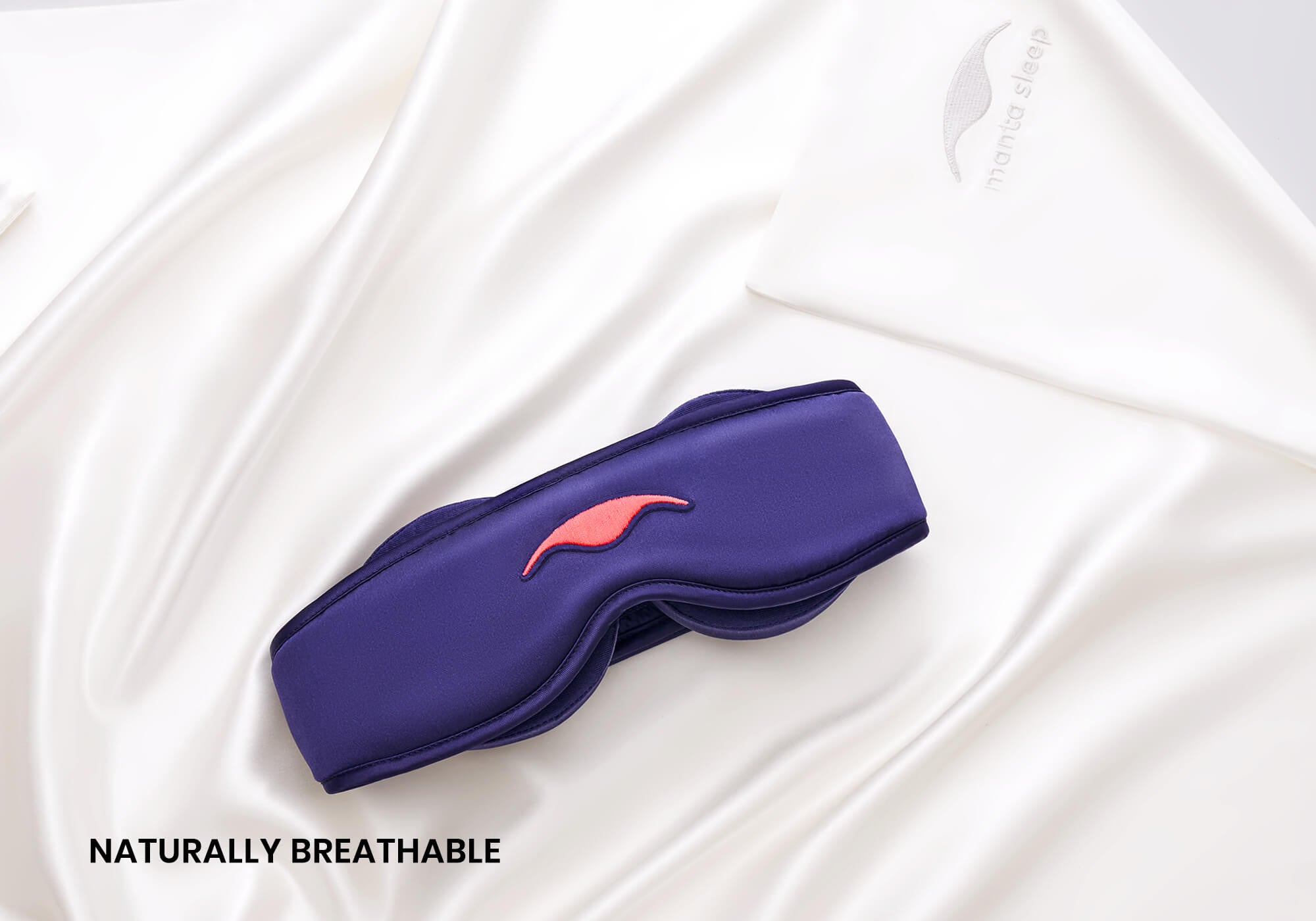 Purple Manta SILK Sleep Mask on top of a pearl white Manta Silk Pillowcase, captioned: "Naturally breathable".