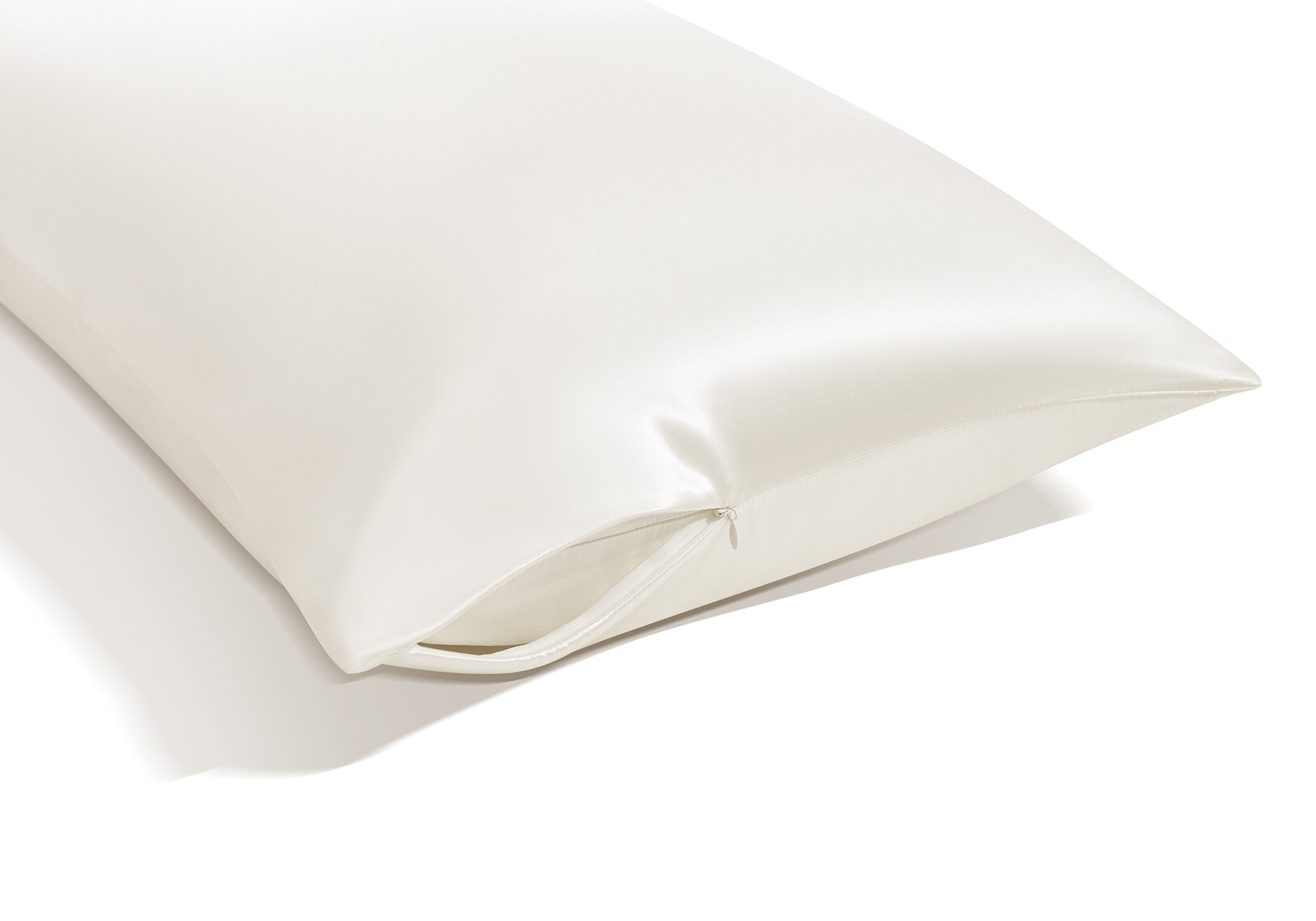 Close-up view of the corner of a pearl white Manta Sleep silk pillowcase showcasing its premium hidden zipper closure.