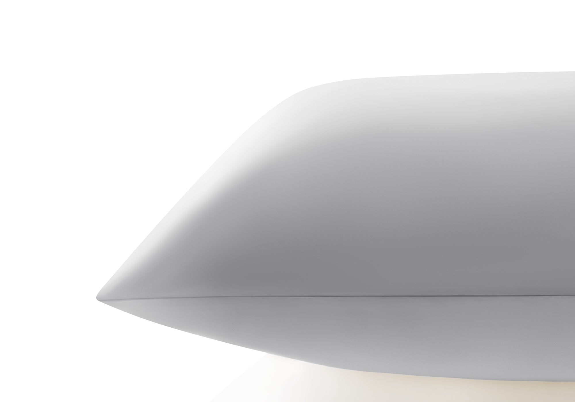 Side profile close-up showing the smooth edge and sleek texture of a crystal silver Manta Sleep silk pillowcase.