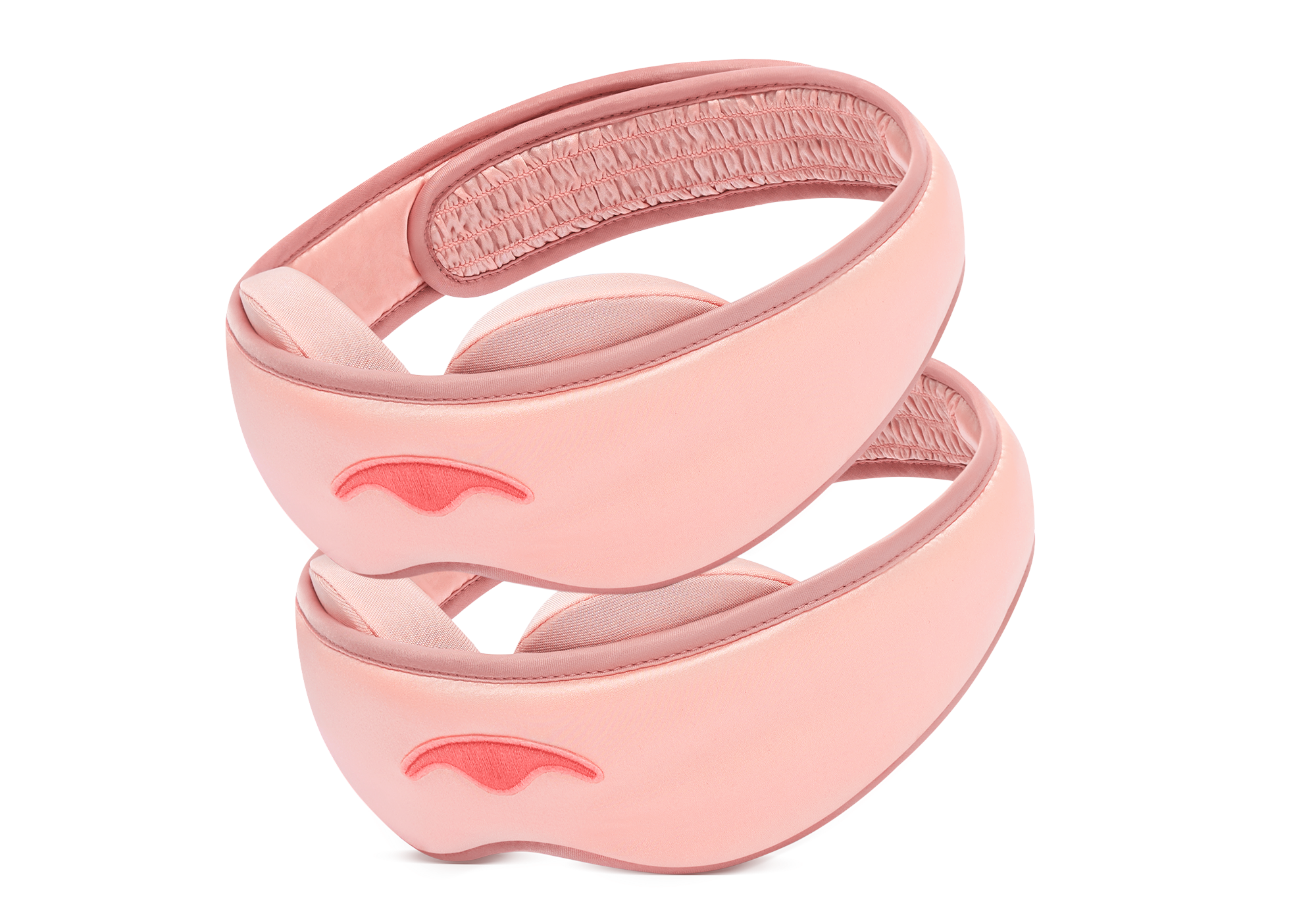 Two light pink Manta SILK Sleep Mask units stacked on a white background, highlighting the smooth silk exterior and adjustable eye cups.