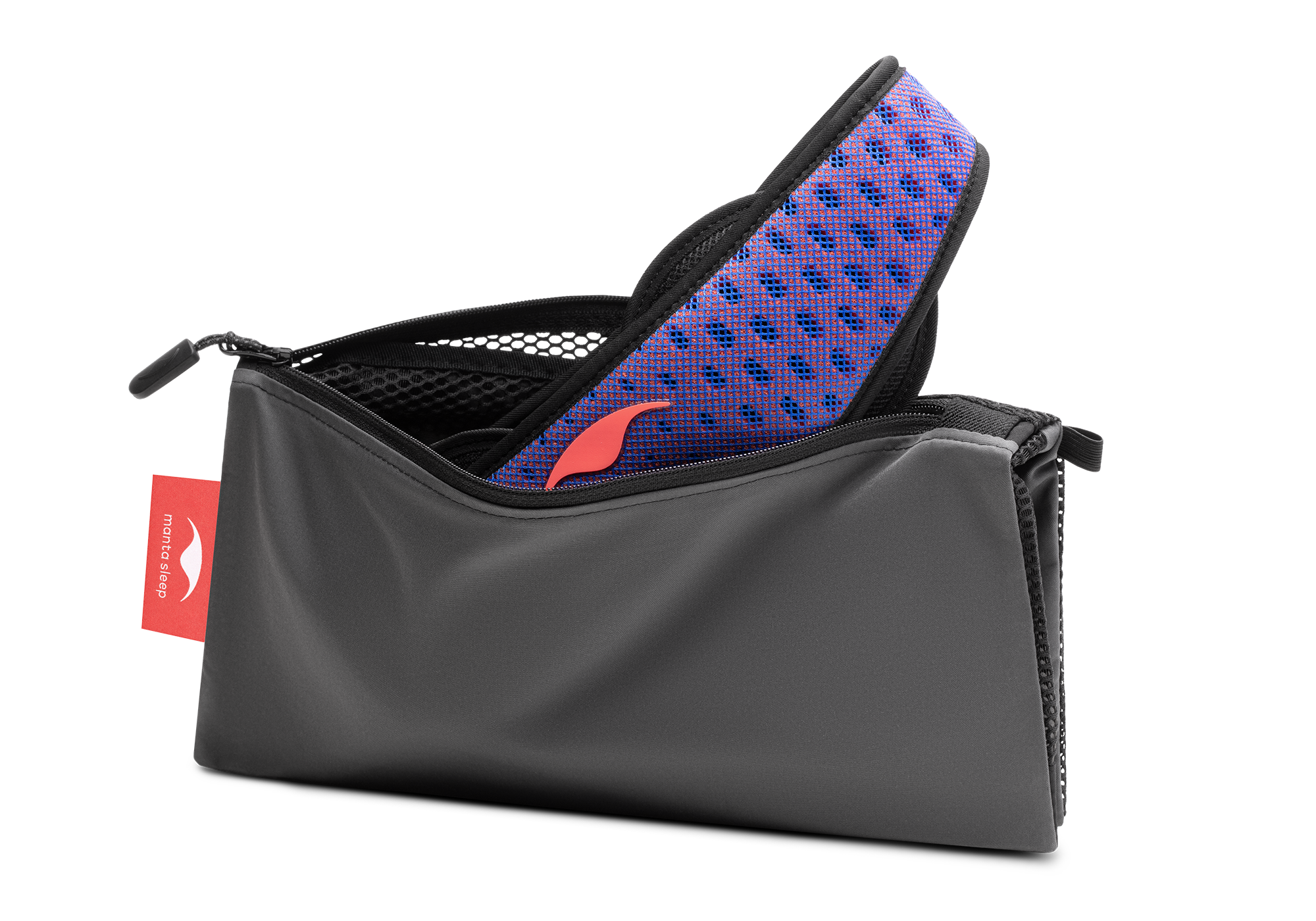 Studio shot of an open, charcoal grey zippered Manta Travel & Laundry Bag with a blue and red Manta PRO Sleep Mask peeking out, isolated on a white background.