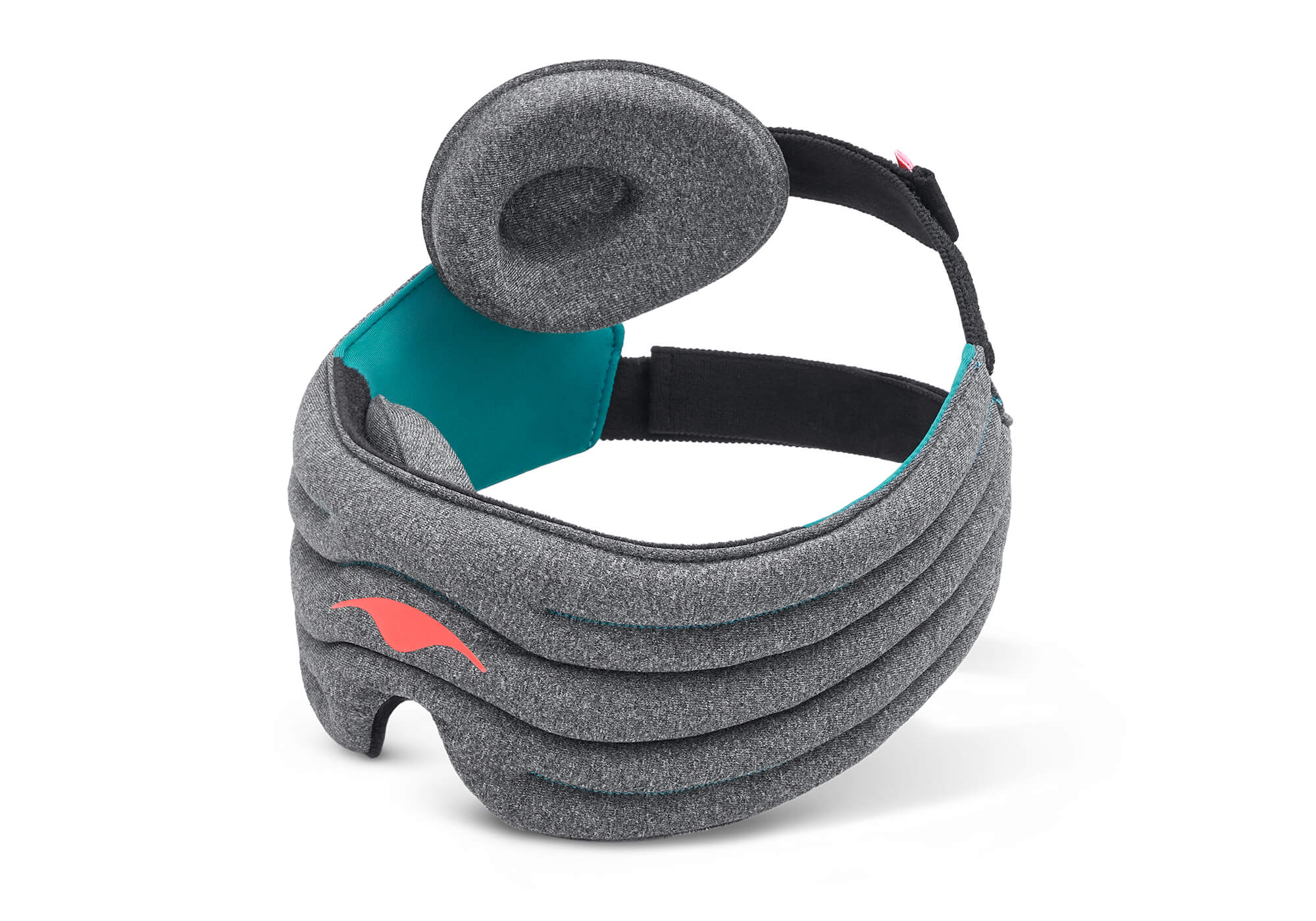 A product shot showcasing the interior side of the Manta WEIGHTED Sleep Mask. The curved mask frame displays a bright teal fabric inner lining on the side panels and a black plush main bridge. One of the modular, contoured heather-gray eye cups is turned upward to show its oval shape and deeply recessed center, while the adjustable black rear strap loops behind.