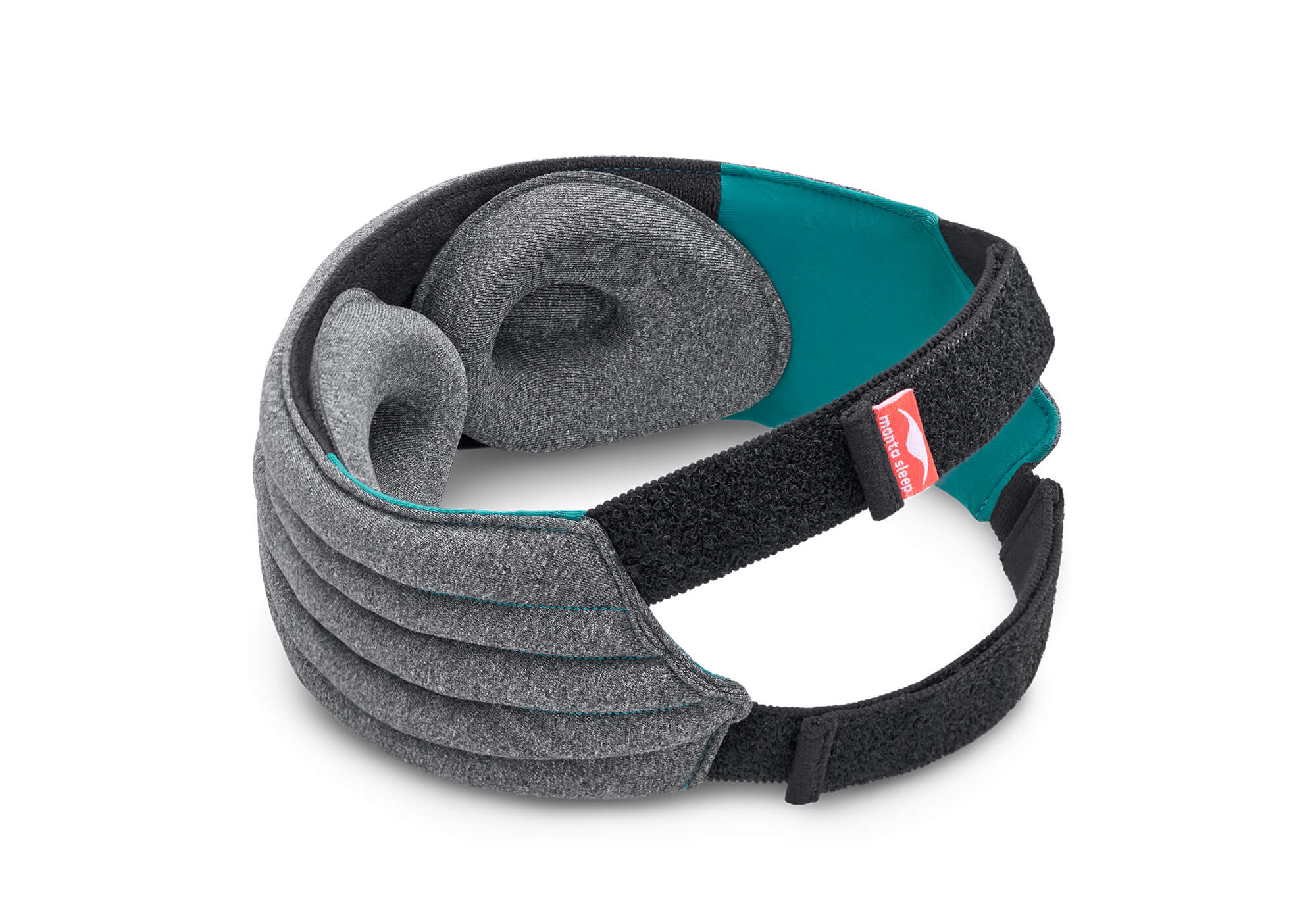 A rear-perspective shot of the Manta WEIGHTED Sleep Mask looped on a white background, displaying the interior construction. Two deeply recessed, heather-gray fabric eye cups are positioned inside the black plush lining. The wide black elastic band joins at the back, featuring a small red fabric tab with the white "manta sleep" logo.