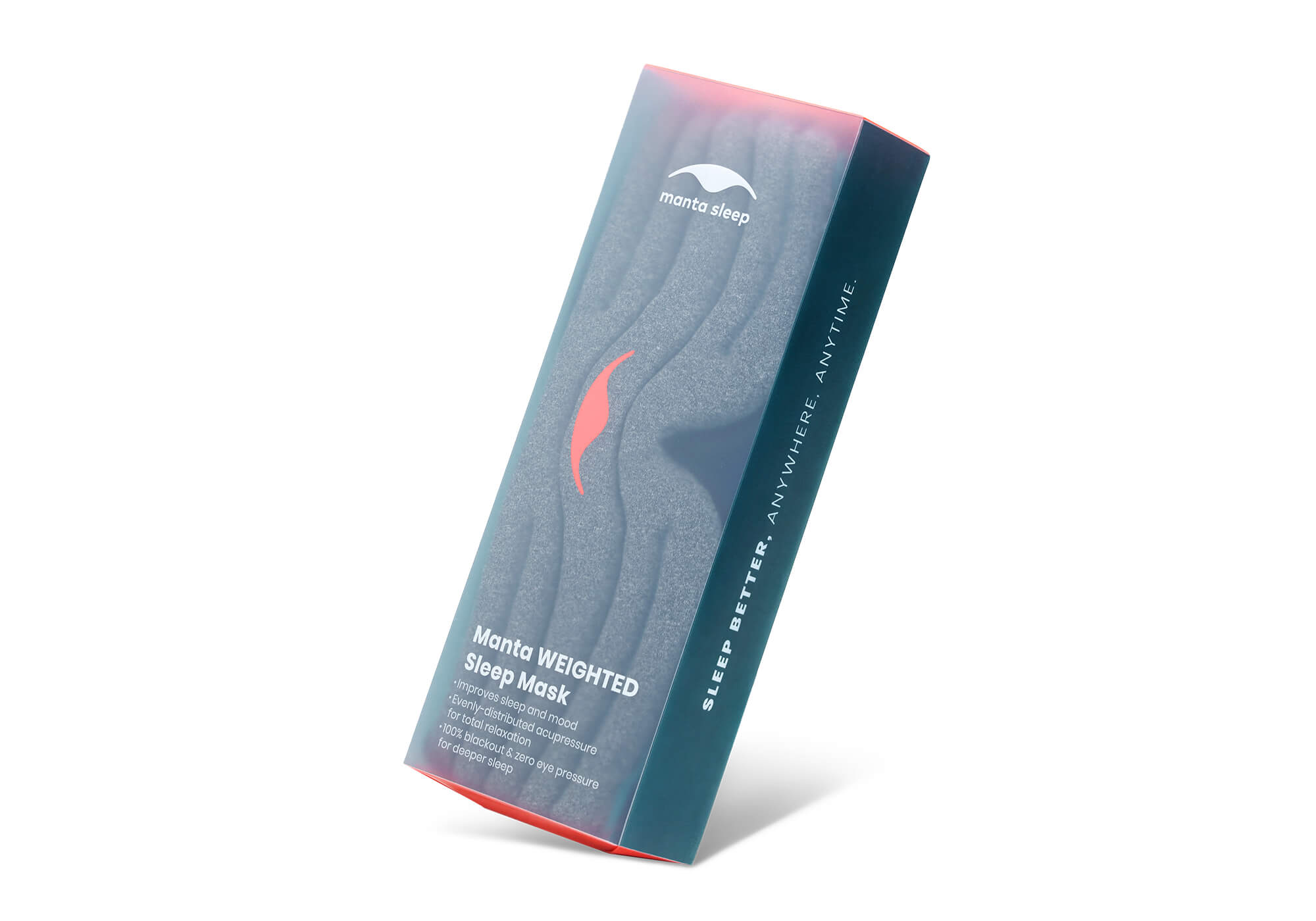 The retail box for the Manta Sleep Mask WEIGHTED, displayed at an angle against a clean white background. The rectangular packaging features a dark navy-blue and charcoal gradient with a translucent front face that subtly reveals the segmented gray mask inside. A bright coral-red Manta logo is centered on the front, with white text below listing product features. The side of the box reads, "SLEEP BETTER. ANYWHERE. ANYTIME."