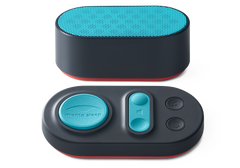 Front view of the oval Manta Sleep white noise speaker with a teal mesh top, paired with its matching teal-buttoned control pad.