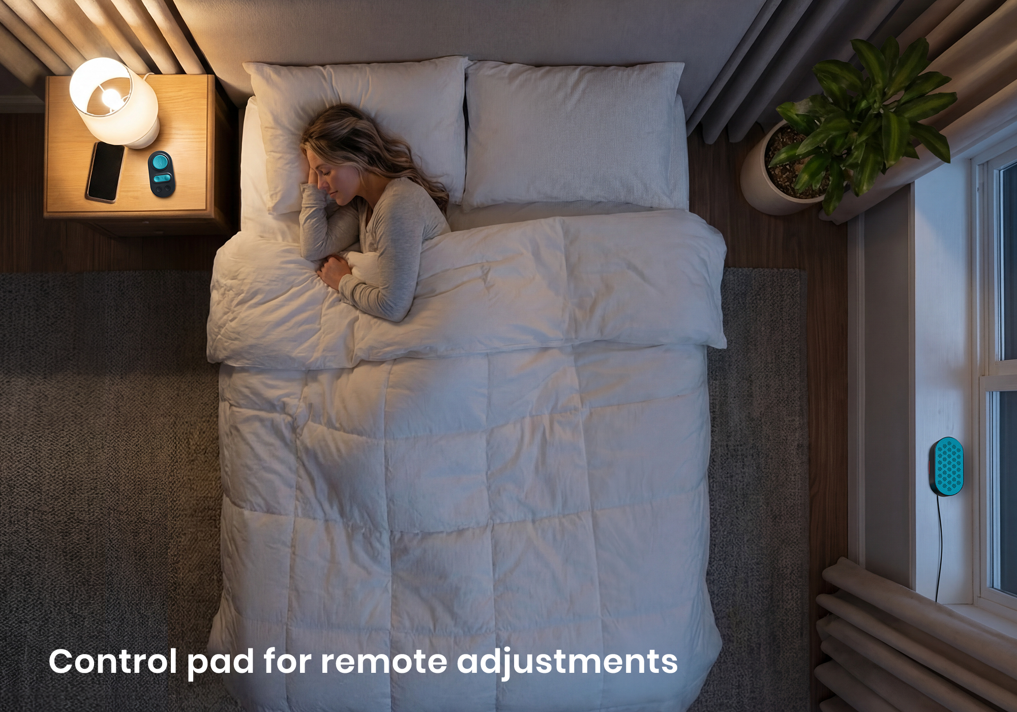 High-angle view of a woman sleeping in bed, with a white noise speaker on the window sill and its control pad on the nightstand.