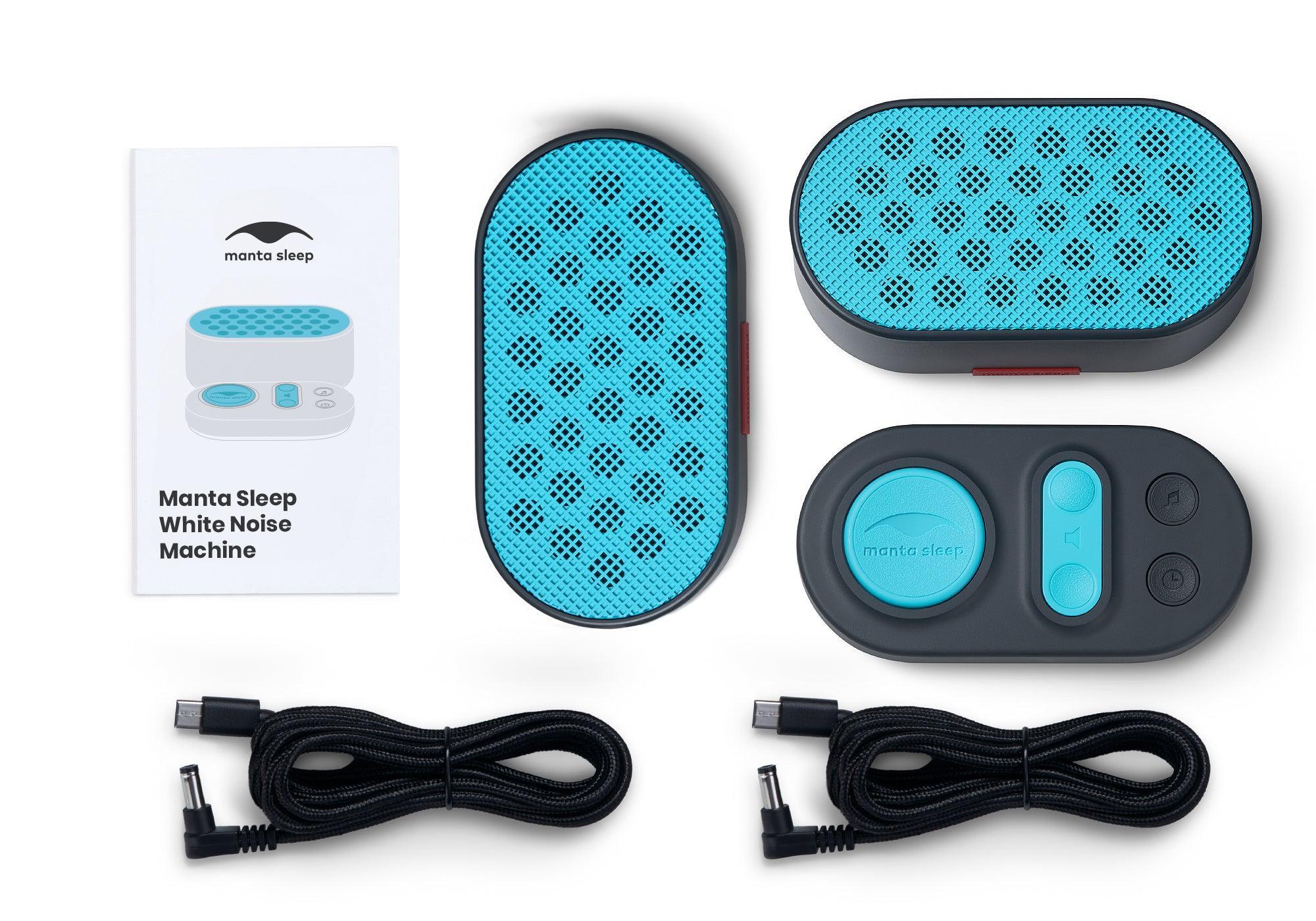 Top-down view of the Manta Sleep White Noise Machine kit including two teal-grille speakers, a controller, two black power cables, and a user manual on white.