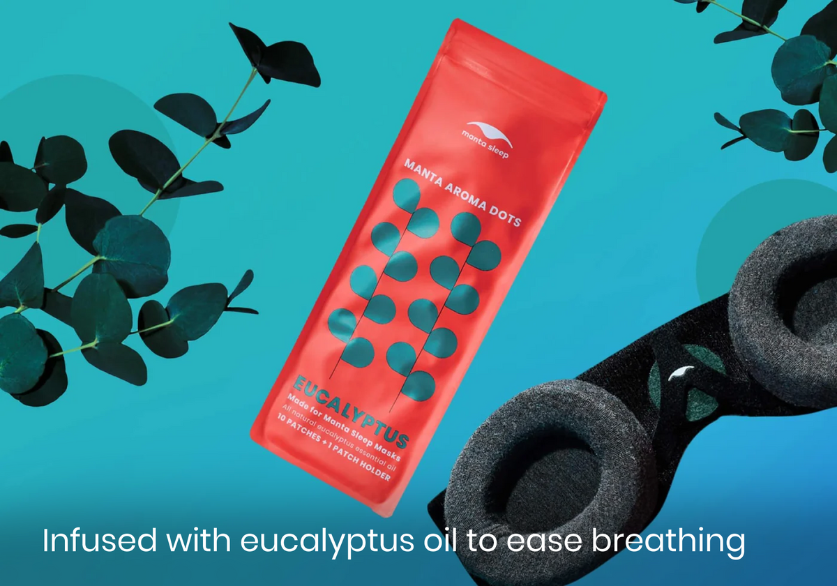 Eucalyptus-scented Manta Aroma Dots packaging shown alongside fresh eucalyptus leaves and a black sleep mask, on a bright teal background, with text: "Infused with eucalyptus oil to ease breathing".
