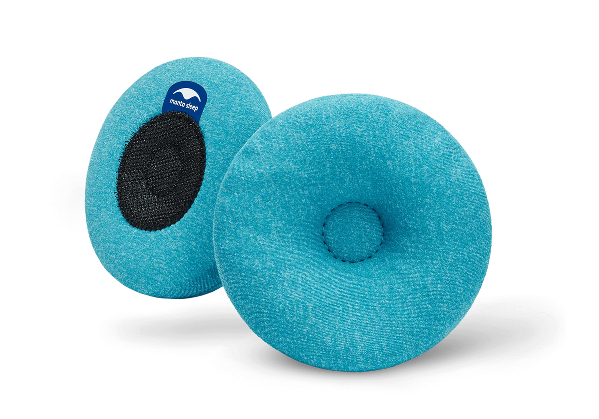 Pair of round blue-teal Manta COOL Eye Cups, showing both the indented front side and the black hook-and-loop back side on white.
