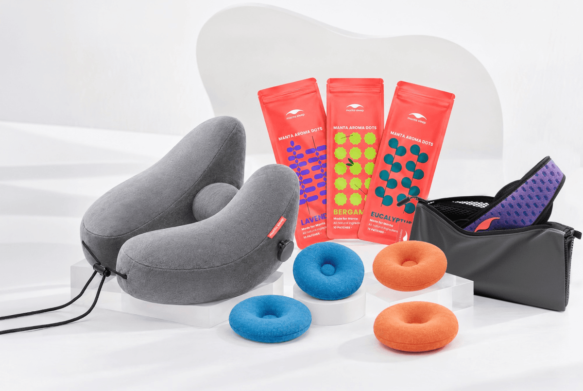 Showcase of different Manta Sleep accessories: Travel Pillow, AROMA Dots, COOL Eye Cups, STEAM Eye Cups and Manta Travel & Laundry Bag.
