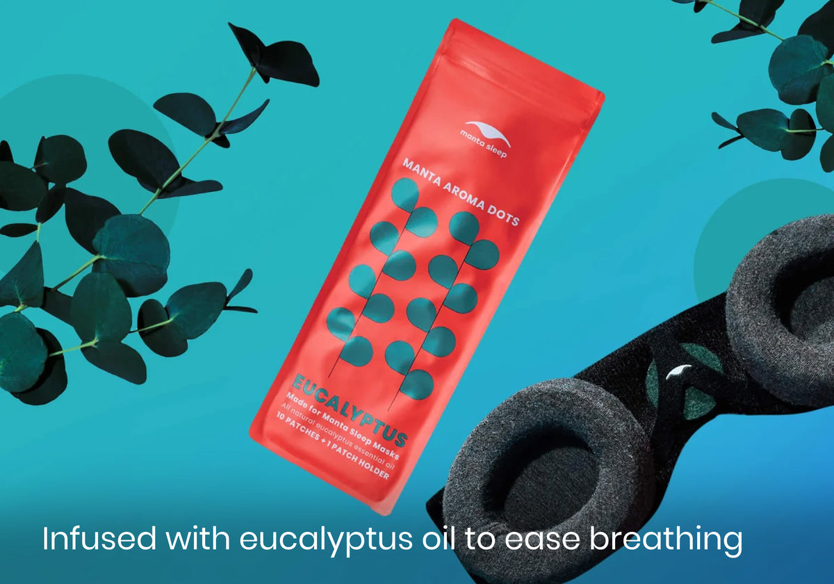 Manta Aroma Dots packet next to black sleep mask and eucalyptus branches with text "Infused with eucalyptus oil to ease breathing".