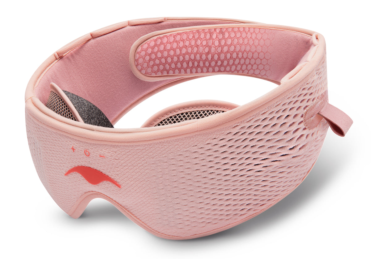 Pink Manta SOUND Mask showcasing its textured fabric, adjustable strap, integrated eye cups, control buttons, and Manta Sleep logo.