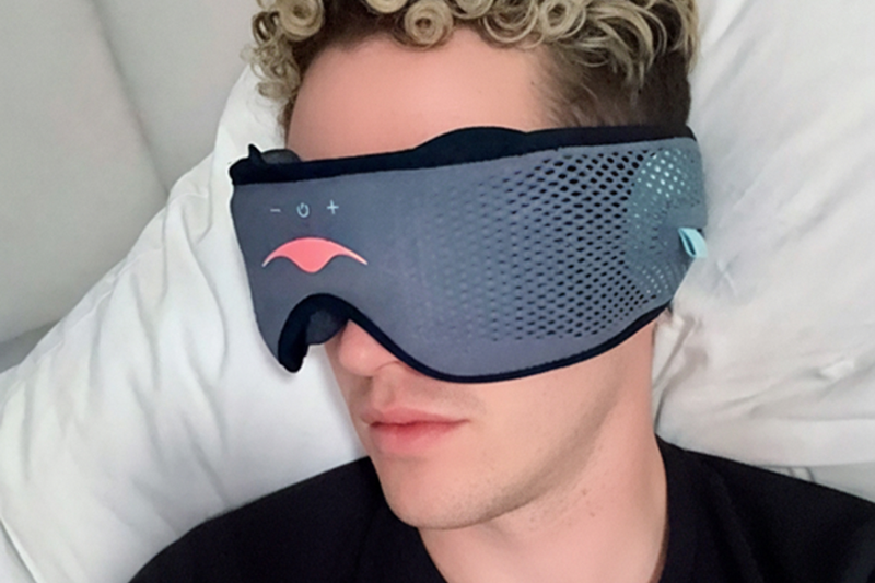 Person wearing a classic Manta SOUND Sleep Mask, lying down.