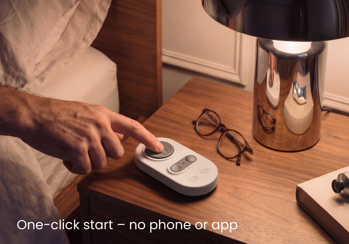 Person pressing a button on the Stone White remote on a nightstand. Text: One-click start – no phone or app.