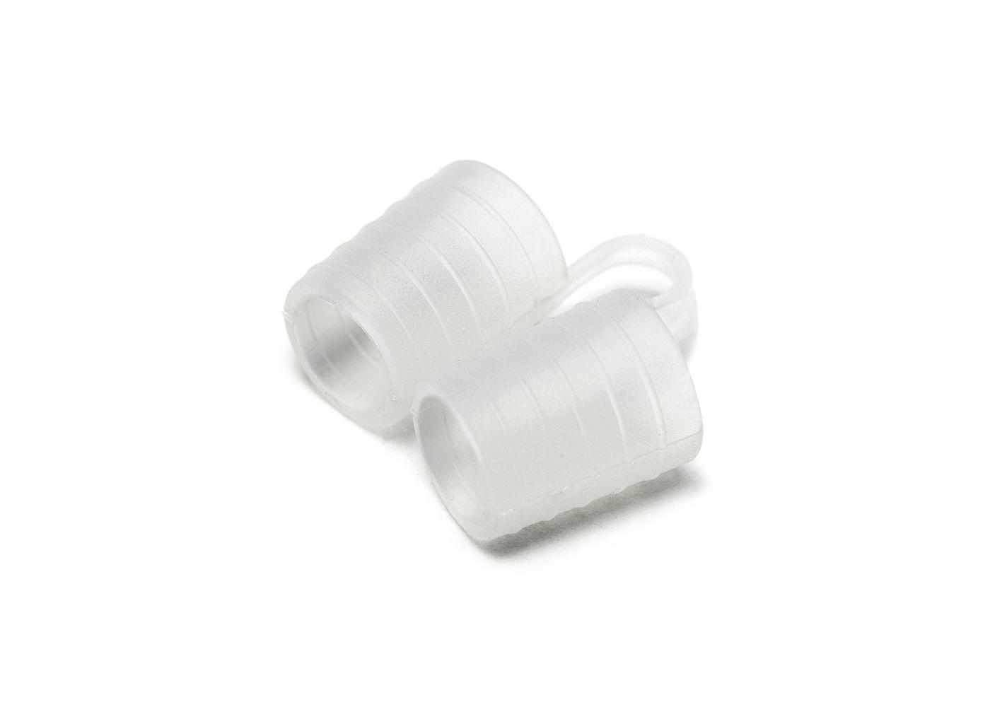 Studio shot of a single translucent silicone nose vent with a ribbed structure, isolated on a white background.