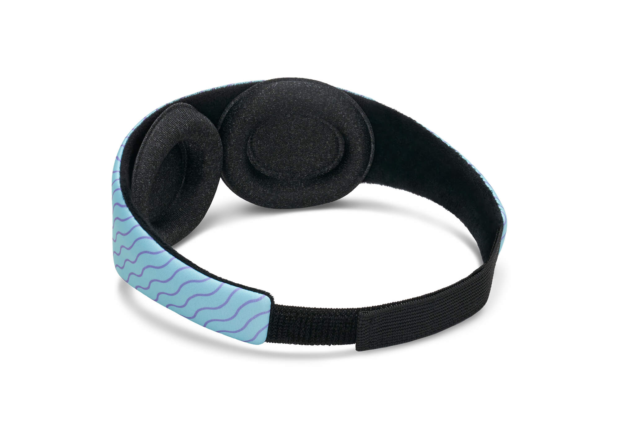 A rear-angle product shot showcasing the interior structure of the Manta KIDS Sleep Mask in a wave pattern variant. The mask features a light blue outer band with purple wavy lines, two adjustable black fabric eye cups, and a black elasticized rear strap.