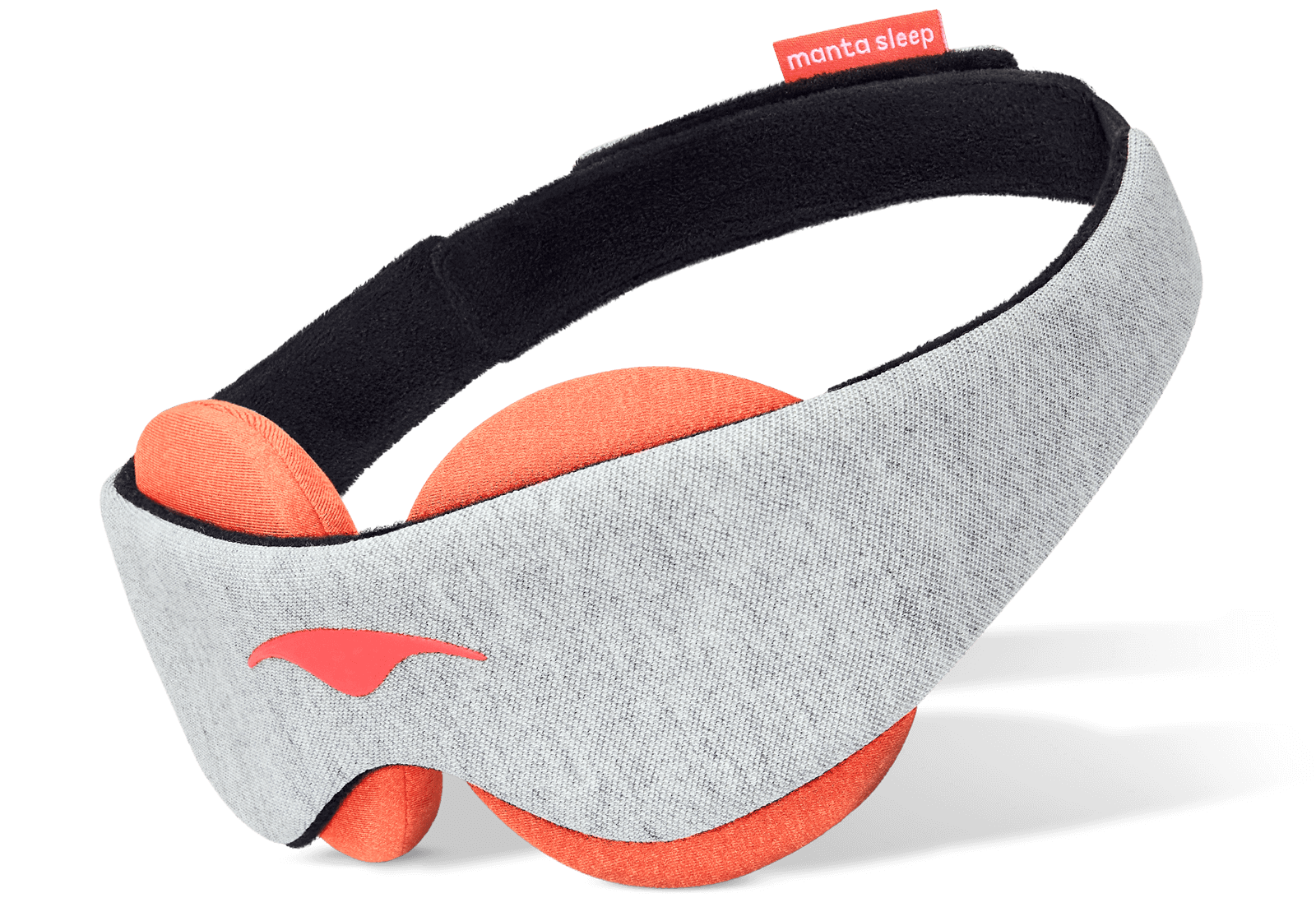 An angled product shot of the Manta STEAM Sleep Mask floating against a crisp white background. The exterior body displays a soft light gray heathered fabric with a coral-pink Manta Sleep logo on the left profile, while the interior reveals thick circular terracotta-orange eye cups designed for heat therapy, attached to a black padded head strap.