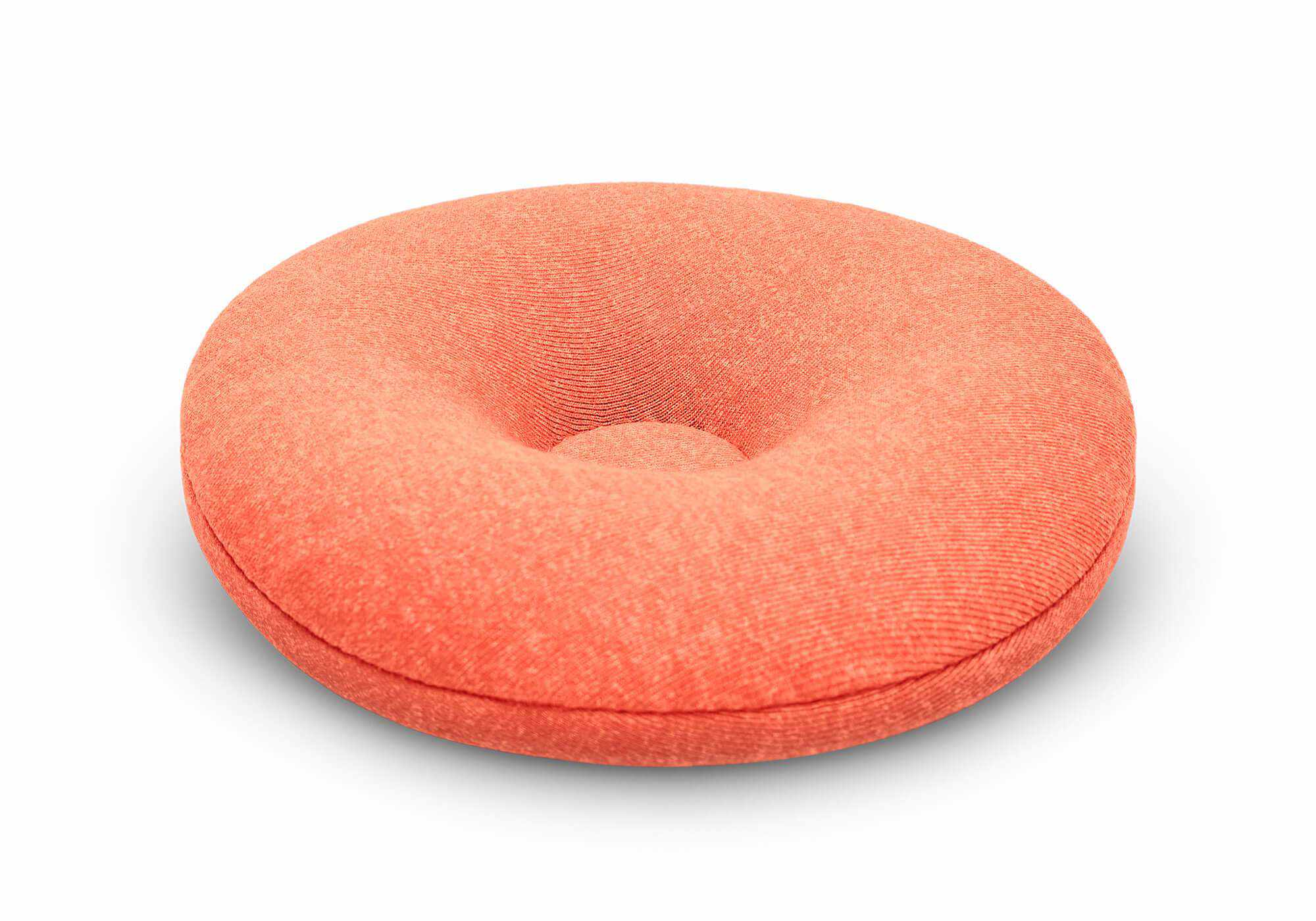 Close-up, angled studio shot of a single circular orange fabric eye cup with a tapered center on a white background.