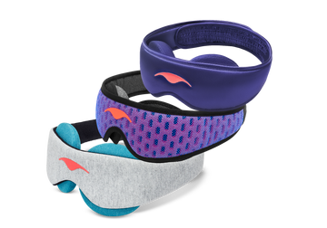 Three stacked Manta Sleep masks: a purple Manta SILK Sleep Mask on top, a blue and red Manta PRO Sleep Mask in the middle, and a grey Manta COOL Sleep Mask with blue-teal eye cups on the bottom.
