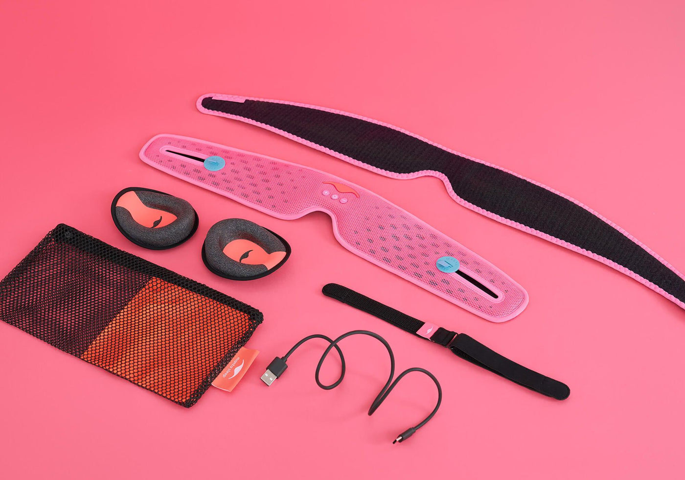 Set of pink and black fitness accessories, including a waist belt, eye masks, and a USB charging cable.