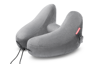 High-angle studio shot of an inflated grey plush Manta Travel Pillow with an adjustable front drawstring cord.