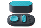 Front view of the oval Manta Sleep white noise speaker with a teal mesh top, paired with its matching teal-buttoned control pad.