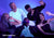Five people on a couch under harsh blue light shields their eyes from glare, except one man wearing a black-out Manta Sleep Mask PRO, with caption "100% blackout".