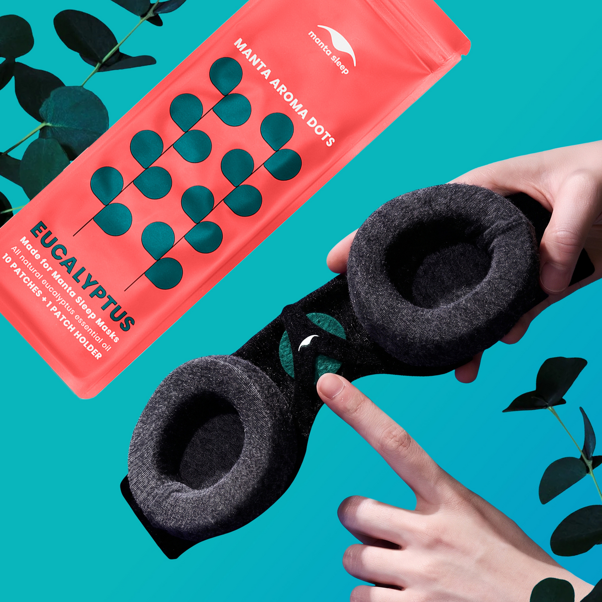 A back of Manta Sleep Mask holding Eucalyptus-scented Manta Aroma Dot, held by two hands against a bright turquoise background.