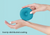 A teal blue Manta COOL Eye Cup held between two hands against a light blue background, with the text 'Evenly-distributed cooling'.