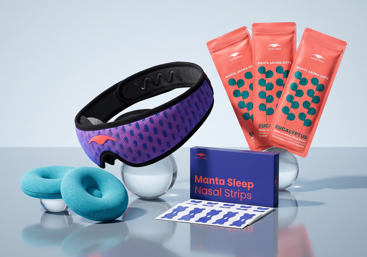 Manta Breathe Easy Bundle products, including Manta PRO Sleep Mask, Manta Aroma Dots, Manta COOL Eye Cups and Manta Nasal Strips, on a reflective gray surface.