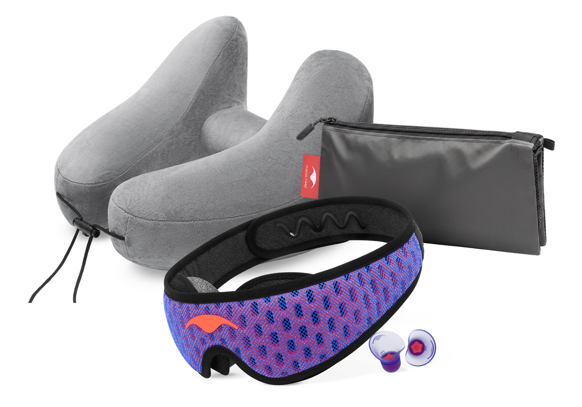 Manta PRO Traveler Bundle containing classic purple Manta PRO Sleep Mask, gray Manta Travel Pillow, gray Manta Travel & Laundry Bag and purple Manta Sleep Earplugs.